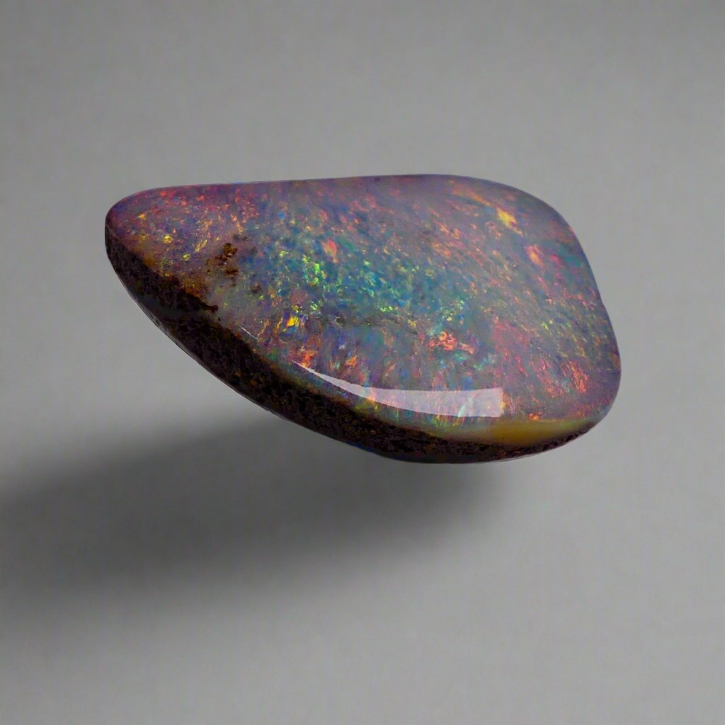 Discover the mesmerizing beauty of this Stunning 6.35ct Australian Boulder Opal, showcasing vibrant pinks and greens. With its bold color play and impressive 6.65ct size, this opal is sure to captivate any gemstone enthusiast. Add a touch of rare elegance to your collection with this Australian treasure.
Origin- Queensland Australia
Weight- 6.35ct Australian Boulder Opal
Size- 18.7 x 12.3 x 3.8mm
Treatments- None 100% solid Australian Opal
Cut- Freeform Shape