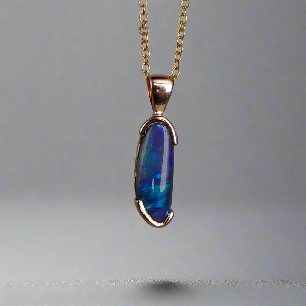 This exquisite pendant features an elegant 9k gold setting, making it a timeless addition to any jewelry collection. The centerpiece is a rare Lightning Ridge semi black crystal opal, known for its striking color and natural beauty. Add a touch of luxury to any outfit with this stunning pendant.
Origin- Ethically Mined From Lightning Ridge Australia
Opal- 2.1ct Lightning Ridge Semi Black Crystal Opal
Setting- 9k Gold Bezel Set
Pendant Size- 27.3x7.3mm Including Bail