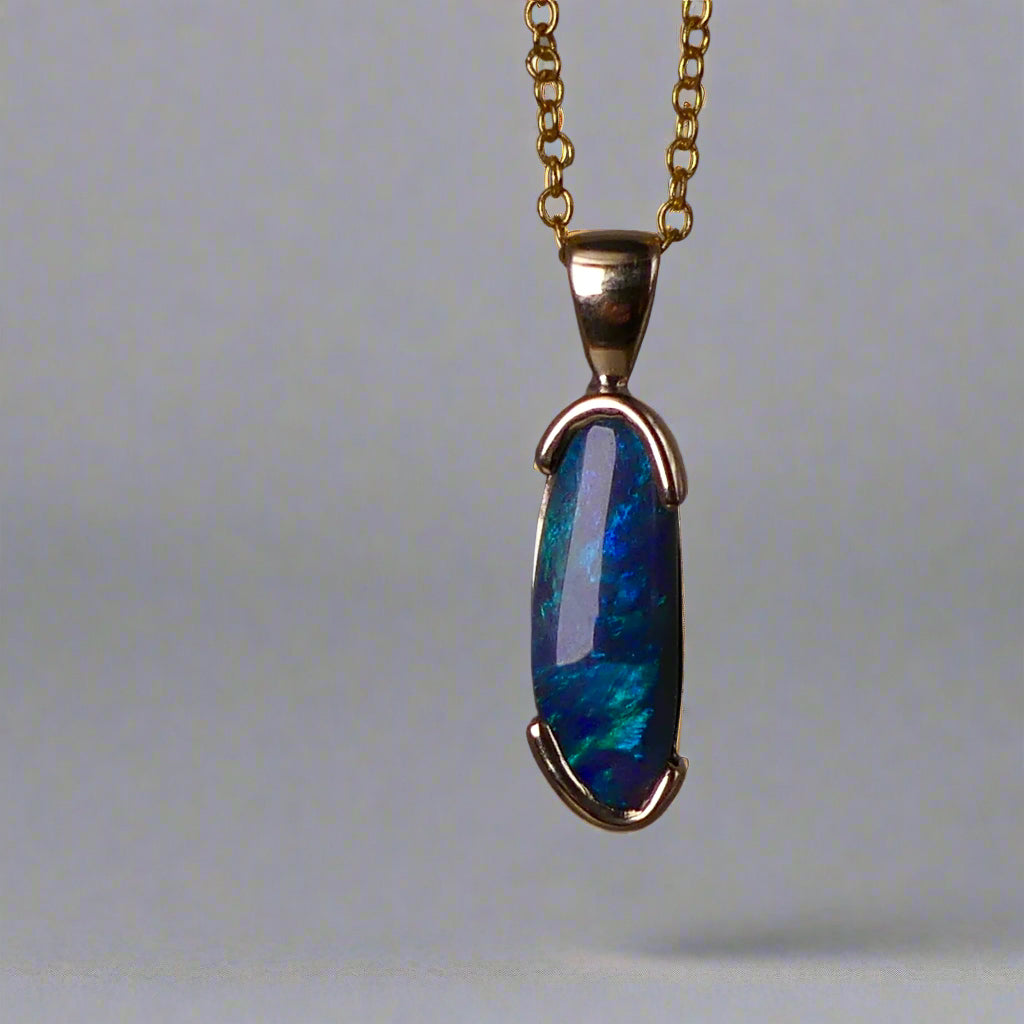 This exquisite pendant features an elegant 9k gold setting, making it a timeless addition to any jewelry collection. The centerpiece is a rare Lightning Ridge semi black crystal opal, known for its striking color and natural beauty. Add a touch of luxury to any outfit with this stunning pendant.
Origin- Ethically Mined From Lightning Ridge Australia
Opal- 2.1ct Lightning Ridge Semi Black Crystal Opal
Setting- 9k Gold Bezel Set
Pendant Size- 27.3x7.3mm Including Bail