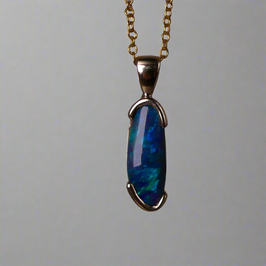 This exquisite pendant features an elegant 9k gold setting, making it a timeless addition to any jewelry collection. The centerpiece is a rare Lightning Ridge semi black crystal opal, known for its striking color and natural beauty. Add a touch of luxury to any outfit with this stunning pendant.
Origin- Ethically Mined From Lightning Ridge Australia
Opal- 2.1ct Lightning Ridge Semi Black Crystal Opal
Setting- 9k Gold Bezel Set
Pendant Size- 27.3x7.3mm Including Bail