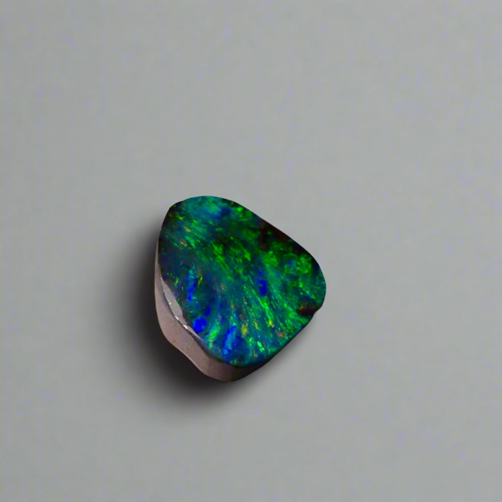Embrace the stunning beauty of the "Ocean Blue" 2.8ct Australian Boulder Opal, a ring stone that radiates vibrant ocean blues and greens. This exquisite opal captures the essence of the ocean with its brilliant color play, making it an irresistible choice for a unique and elegant jewelry piece.