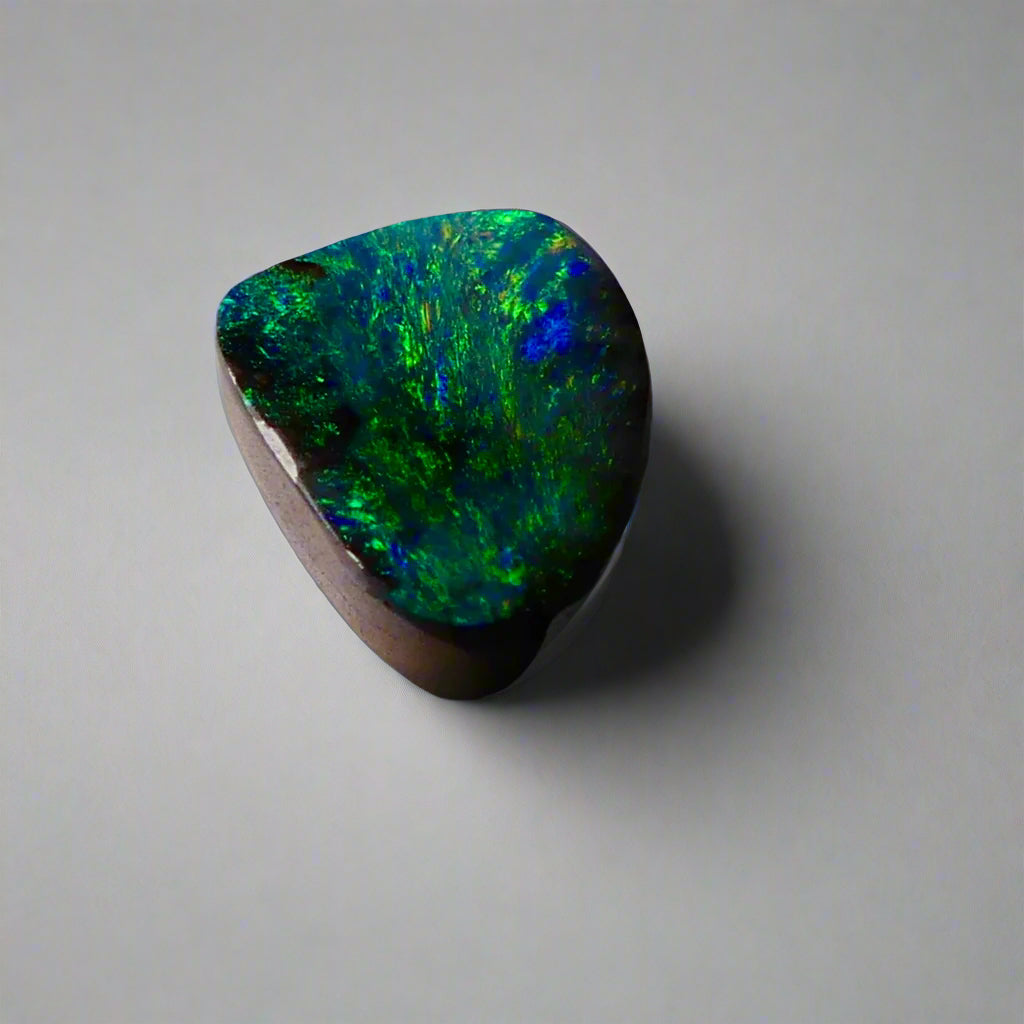 Embrace the stunning beauty of the "Ocean Blue" 2.8ct Australian Boulder Opal, a ring stone that radiates vibrant ocean blues and greens. This exquisite opal captures the essence of the ocean with its brilliant color play, making it an irresistible choice for a unique and elegant jewelry piece.