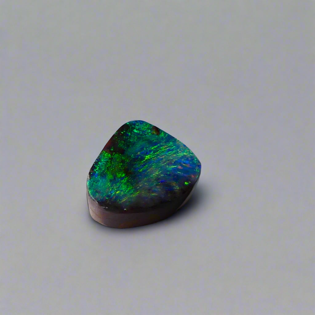 Embrace the stunning beauty of the "Ocean Blue" 2.8ct Australian Boulder Opal, a ring stone that radiates vibrant ocean blues and greens. This exquisite opal captures the essence of the ocean with its brilliant color play, making it an irresistible choice for a unique and elegant jewelry piece