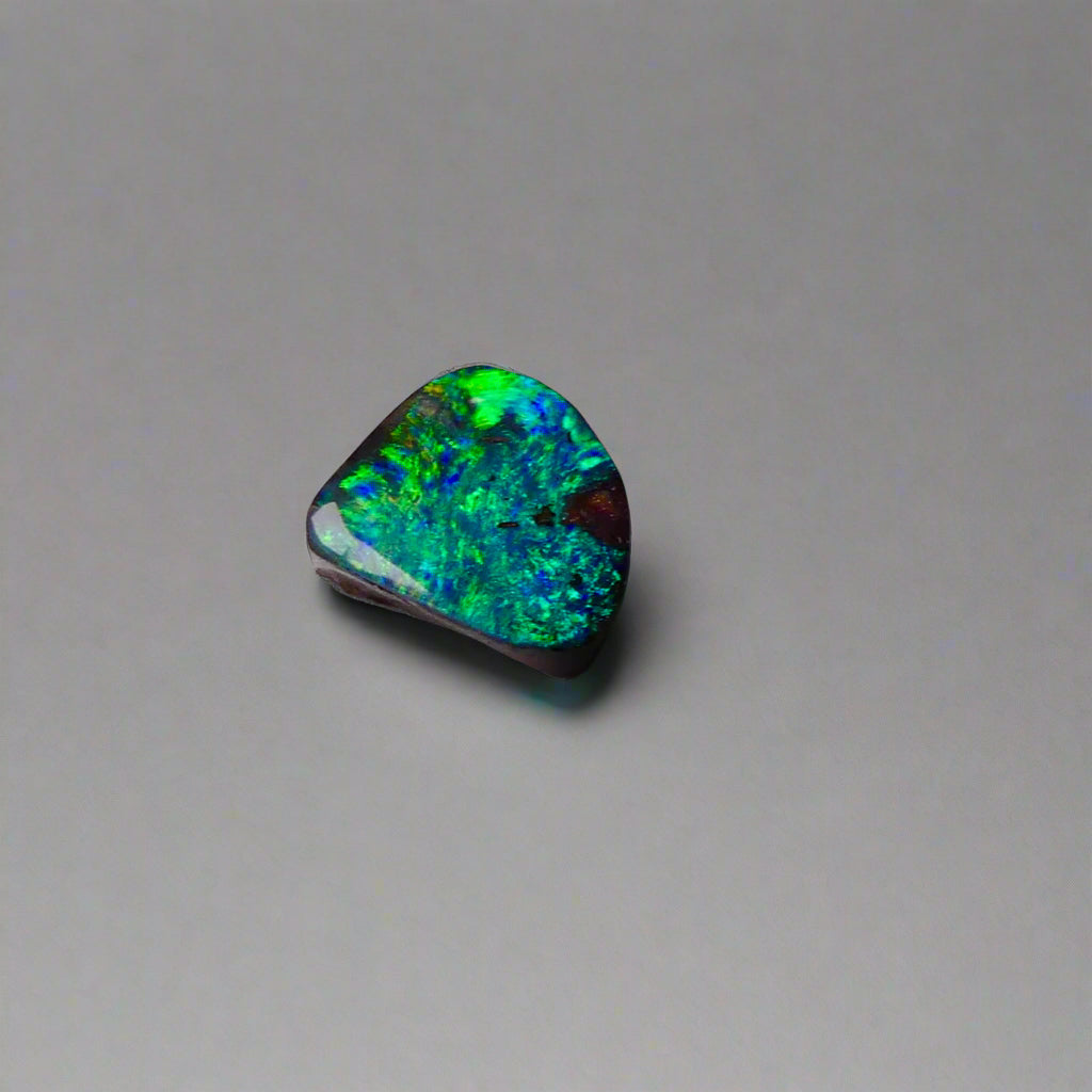 Discover the captivating beauty of this 1.8ct Ocean Blue Australian Boulder Opal. Its vibrant blue hues and natural patterns make it a unique opal, Sourced from Australia’s renowned Opalton opal fields, this opal promises both rarity and lasting brilliance.