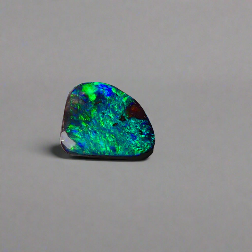 Discover the captivating beauty of this 1.8ct Ocean Blue Australian Boulder Opal. Its vibrant blue hues and natural patterns make it a unique opal, Sourced from Australia’s renowned Opalton opal fields, this opal promises both rarity and lasting brilliance.