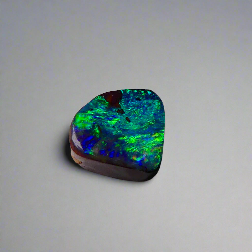 Discover the captivating beauty of this 1.8ct Ocean Blue Australian Boulder Opal. Its vibrant blue hues and natural patterns make it a unique opal, Sourced from Australia’s renowned Opalton opal fields, this opal promises both rarity and lasting brilliance.