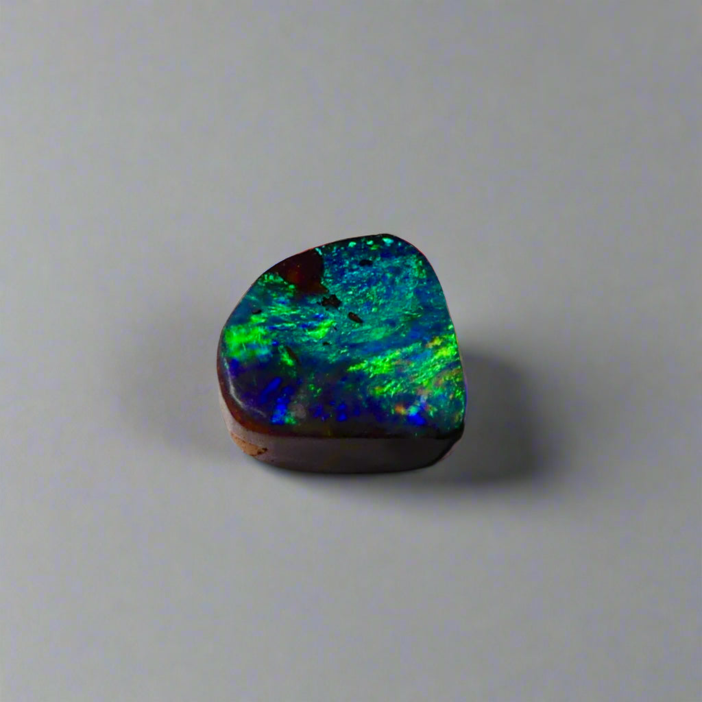 Discover the captivating beauty of this 1.8ct Ocean Blue Australian Boulder Opal. Its vibrant blue hues and natural patterns make it a unique opal, Sourced from Australia’s renowned Opalton opal fields, this opal promises both rarity and lasting brilliance.