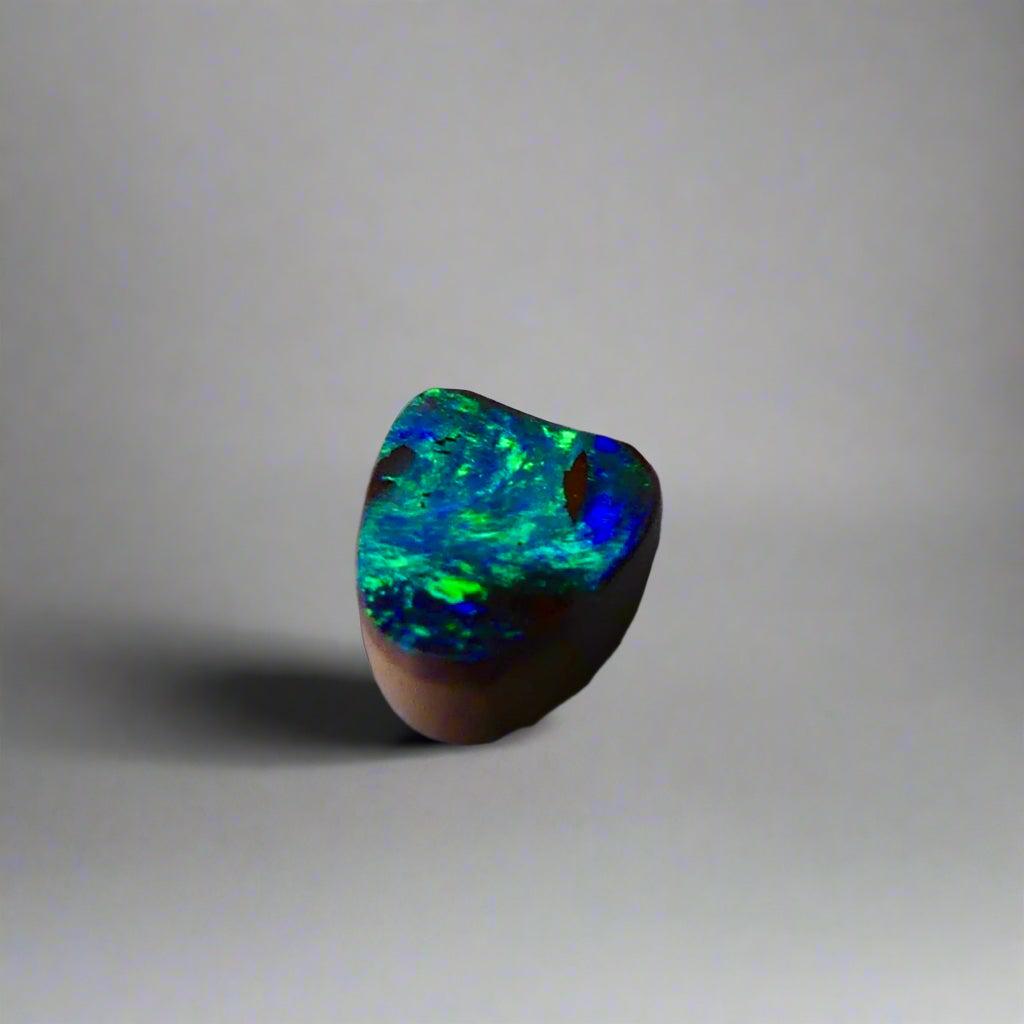 Experience the allure of this stunning 1.90ct Australian Boulder Opal, glowing with vivid green and blue hues. Its vibrant colors and natural brilliance make it an ideal centerpiece for a ring, offering a unique and elegant statement.