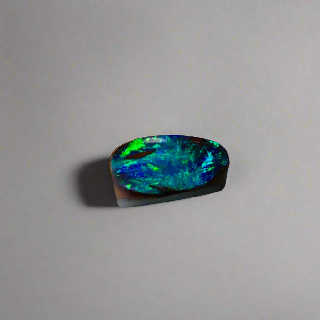 Experience the allure of this stunning 1.90ct Australian Boulder Opal, glowing with vivid green and blue hues. Its vibrant colors and natural brilliance make it an ideal centerpiece for a ring, offering a unique and elegant statement.