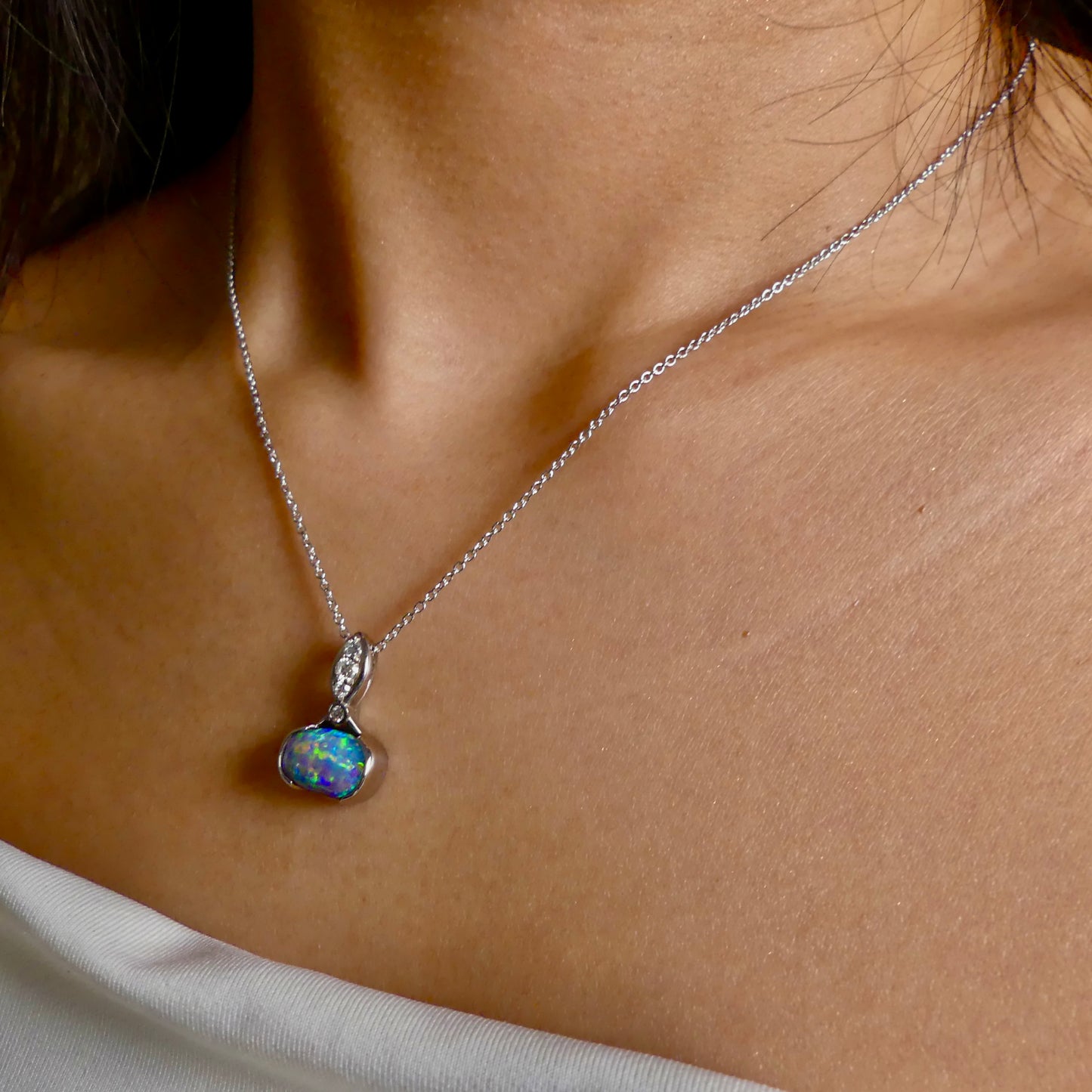 This exquisite pendant features a rare Australian Boulder Opal set in 18k white gold, expertly crafted to highlight the opal’s vibrant play of colors. Accented with natural diamonds, this statement piece that combines exceptional craftsmanship with the distinctive allure of genuine opal.
