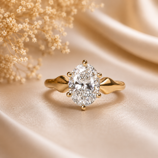 Gold ring with a diamond on a beige fabric background