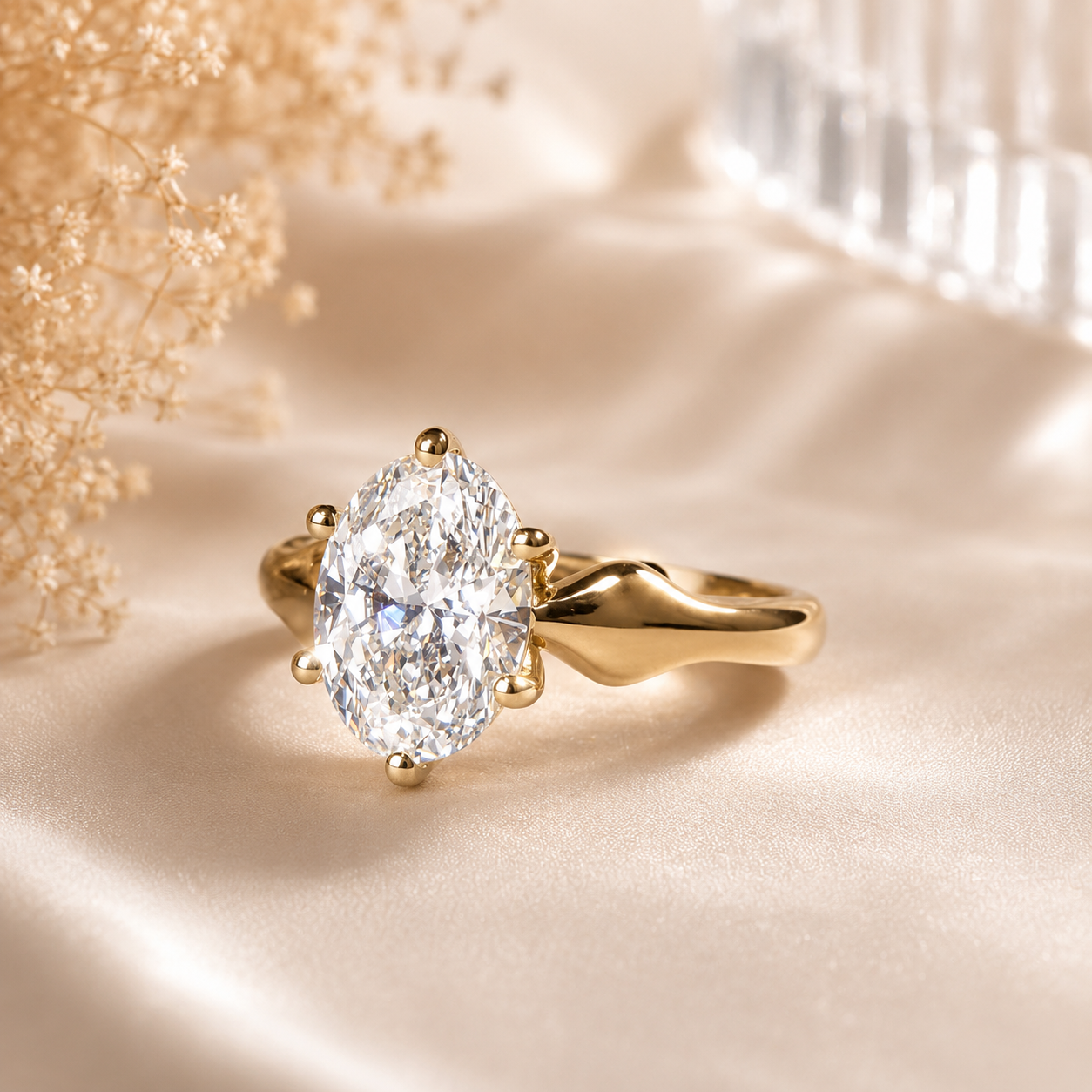 Gold ring with a large diamond on a soft beige background