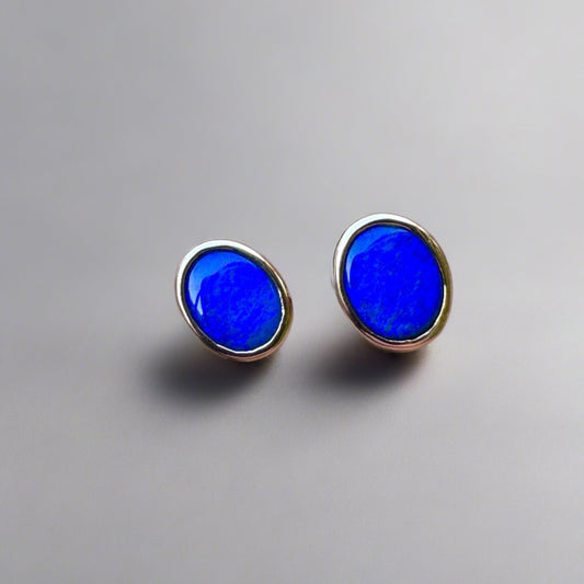 Expertly crafted Lightning Ridge Australian Gold Opal Earrings - an exquisite and unique addition to your jewelry collection. Handcrafted with exceptional attention to detail.

Origin- Lightning Ridge Australia

Opal Weight- Combined weight of 2.4ct Lightning Ridge Seam Opal

Setting- 9K Gold Bezel Set Stud Earrings

Handcrafted and designed by Australian Artisans