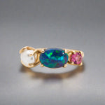 Introducing our stunning Seascapes Collection! This 14k gold ring perfectly captures the beauty and harmony of nature's wonders. Handcrafted to perfection, it is the epitome of elegance.

Origin- Lightning Ridge Australia

Opal Weight- 1ct Australian Black Opal.

Setting- 14k Gold Claw Setting

Accent Stone- Pink Tourmaline

Pearl- Keshi Pearl

Size - 7us -

Handcrafted and designed by Australian Artisans