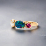 Introducing our stunning Seascapes Collection! This 14k gold ring perfectly captures the beauty and harmony of nature's wonders. Handcrafted to perfection, it is the epitome of elegance.

Origin- Lightning Ridge Australia

Opal Weight- 1ct Australian Black Opal.

Setting- 14k Gold Claw Setting

Accent Stone- Pink Tourmaline

Pearl- Keshi Pearl

Size - 7us -

Handcrafted and designed by Australian Artisans