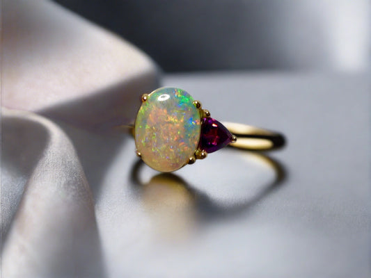Experience the beauty of 14k Gold with our ethically sourced, stunning Australian Crystal Opal ring from Lightning Ridge, Australia.

Origin- Lightning Ridge Australia

Opal Weight- 0.75ct Australian Crystal Opal

Setting- 14k Gold Claw Setting

Accent Stone- Rhodolite Garnet

Ring Size- 6 1/2us

Handcrafted and designed with precision and passion by Australian Artisans.