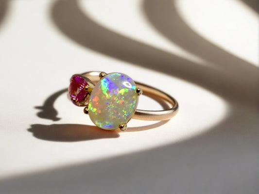 Discover our stunning 14k Gold Australian Crystal Opal Ring, sourced from Lightning Ridge, Australia. Experience its enchanting play-of-color.

Origin- Lightning Ridge Australia.

Opal Weight- 1ct Australian Crystal Opal

Setting- 14k Gold Claw Setting

Accent Stone- Pink Sapphire

Ring Size- 6 1/2us 

Handcrafted and designed by Australian Artisans