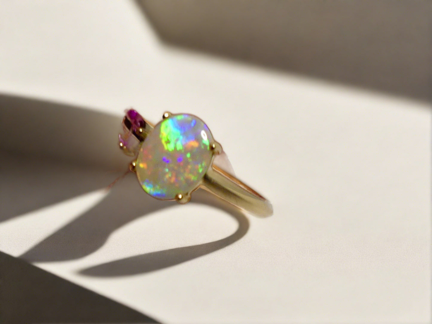 Discover our stunning 14k Gold Australian Crystal Opal Ring, sourced from Lightning Ridge, Australia. Experience its enchanting play-of-color.

Origin- Lightning Ridge Australia.

Opal Weight- 1ct Australian Crystal Opal

Setting- 14k Gold Claw Setting

Accent Stone- Pink Sapphire

Ring Size- 6 1/2us 

Handcrafted and designed by Australian Artisans