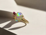 Discover our stunning 14k Gold Australian Crystal Opal Ring, sourced from Lightning Ridge, Australia. Experience its enchanting play-of-color.

Origin- Lightning Ridge Australia.

Opal Weight- 1ct Australian Crystal Opal

Setting- 14k Gold Claw Setting

Accent Stone- Pink Sapphire

Ring Size- 6 1/2us 

Handcrafted and designed by Australian Artisans