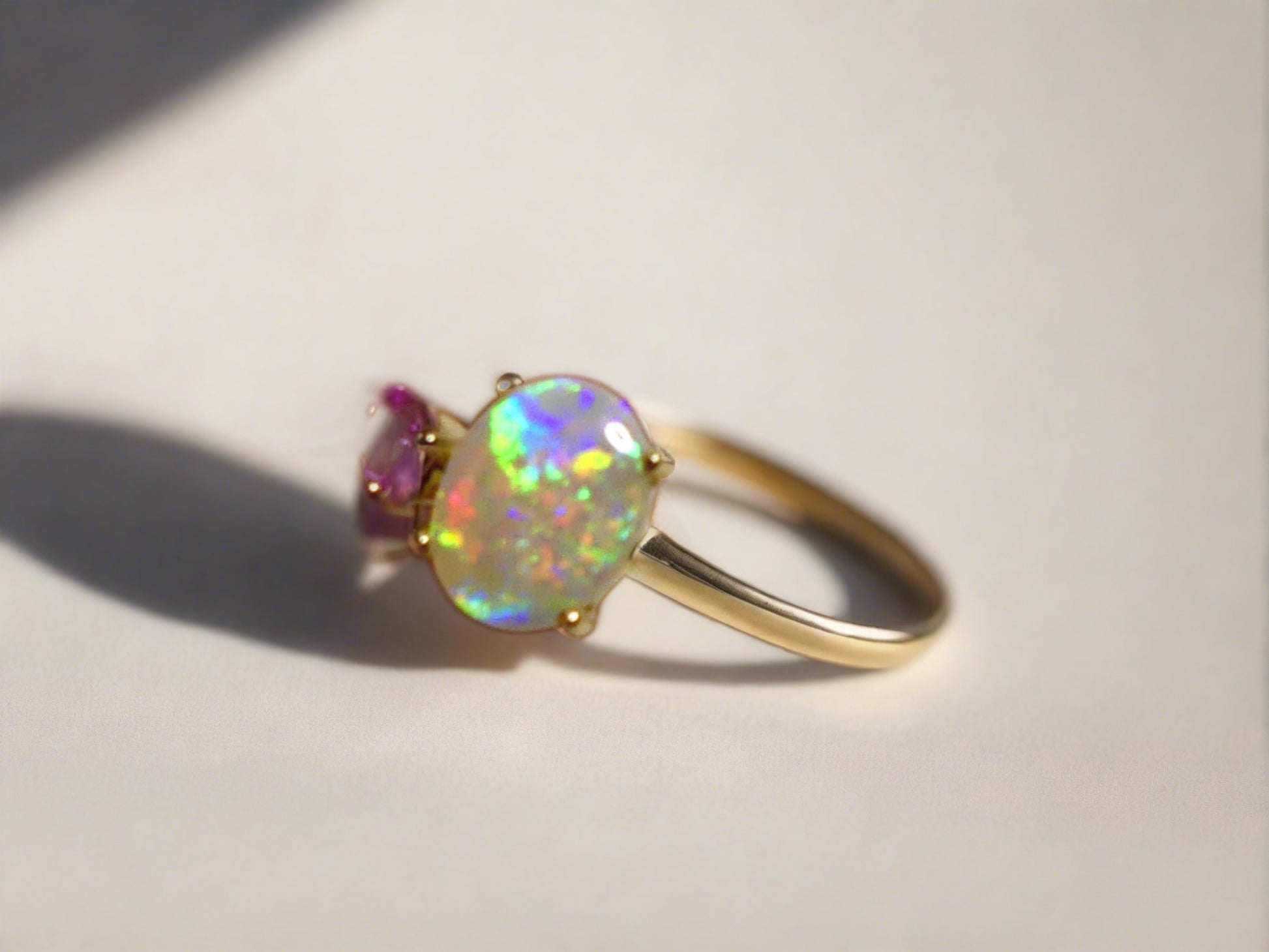 Discover our stunning 14k Gold Australian Crystal Opal Ring, sourced from Lightning Ridge, Australia. Experience its enchanting play-of-color.

Origin- Lightning Ridge Australia.

Opal Weight- 1ct Australian Crystal Opal

Setting- 14k Gold Claw Setting

Accent Stone- Pink Sapphire

Ring Size- 6 1/2us 

Handcrafted and designed by Australian Artisans