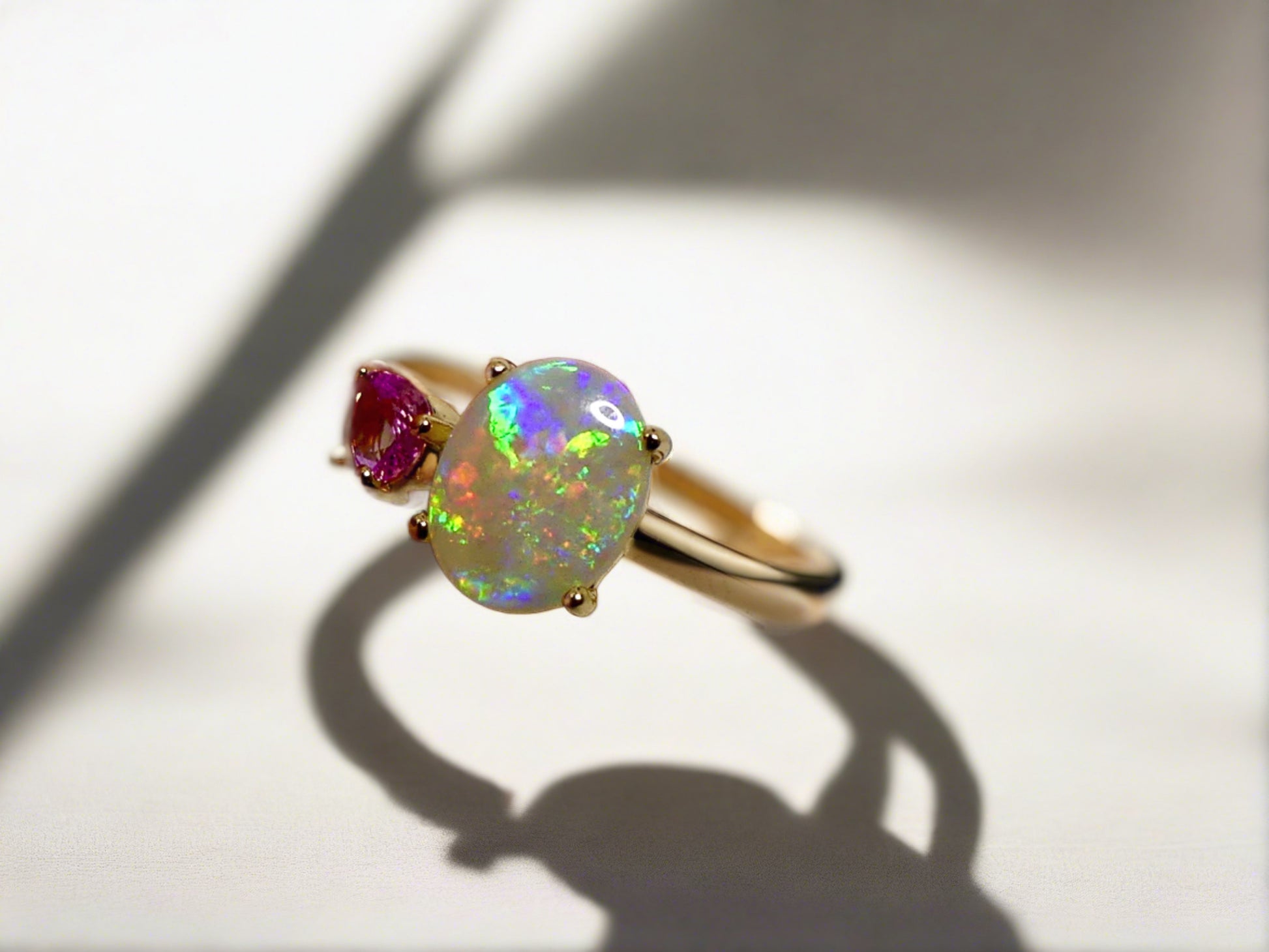 Discover our stunning 14k Gold Australian Crystal Opal Ring, sourced from Lightning Ridge, Australia. Experience its enchanting play-of-color.

Origin- Lightning Ridge Australia.

Opal Weight- 1ct Australian Crystal Opal

Setting- 14k Gold Claw Setting

Accent Stone- Pink Sapphire

Ring Size- 6 1/2us 

Handcrafted and designed by Australian Artisans