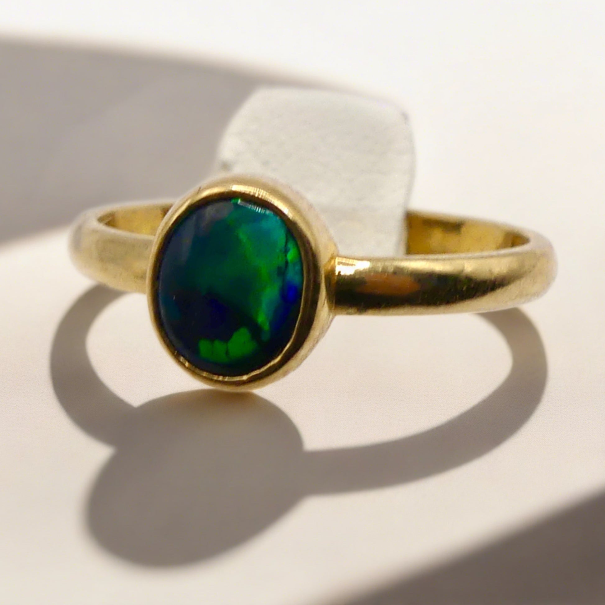 Discover our stunning Lightning Ridge Black Opal Gold Ring, crafted by expert Australian artisans. This rare gemstone is known for its breathtaking colors and exclusivity.

Origin- Lightning Ridge Australia

Opal Weight- 0.5ct Lightning Ridge Black Opal

Setting- 9K Gold Bezel Set

Size- Ring Size 6 1/4us

Handcrafted and Designed by passionate Australian Artisans
