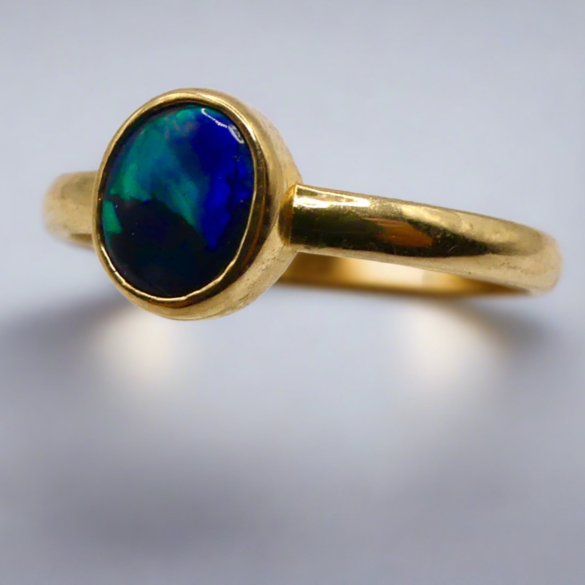 Discover our stunning Lightning Ridge Black Opal Gold Ring, crafted by expert Australian artisans. This rare gemstone is known for its breathtaking colors and exclusivity.

Origin- Lightning Ridge Australia

Opal Weight- 0.5ct Lightning Ridge Black Opal

Setting- 9K Gold Bezel Set

Size- Ring Size 6 1/4us

Handcrafted and Designed by passionate Australian Artisans
