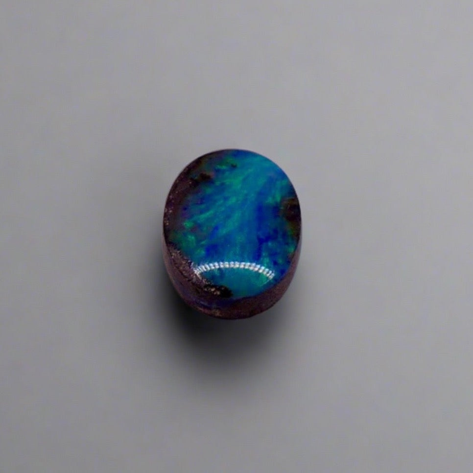 Dazzle your jewelry collection with this mesmerizing Australian Boulder Opal. Its stunning greens and blues are perfect for any design.

Origin- Ethically mined in Queensland Australia

Weight- 1.6c

Size- 9 x 7mm