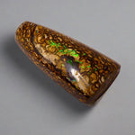 Experience the stunning 27.6ct Koroit Boulder Opal. Its vibrant greens and directional flash make it a unique and breathtaking addition to any collection.

Origin- Queensland Australia

Opal Weight- 27.4ct Koroit Boulder Opal

Size- 29 x 15mm

Beautiful Opal suitable for a Pendant setting.
