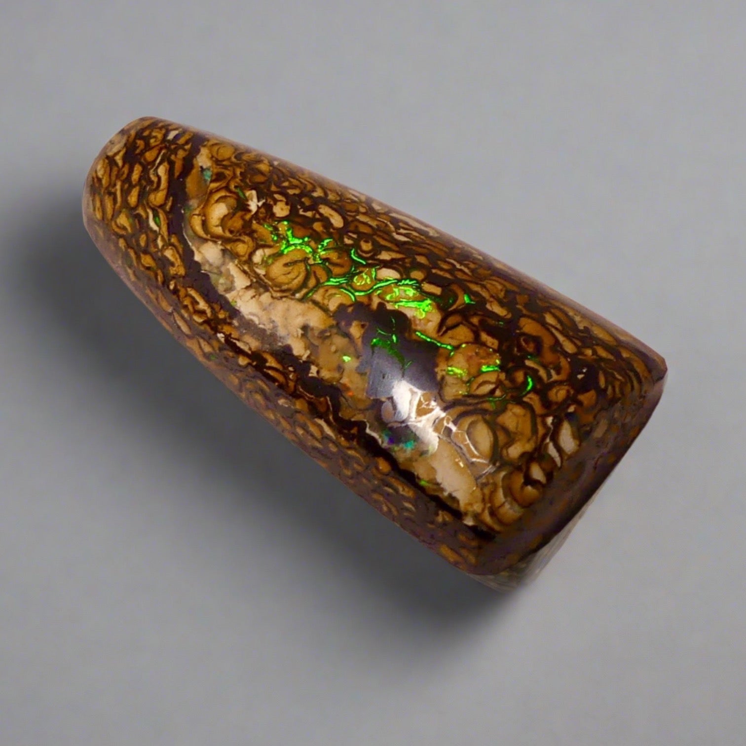 Experience the stunning 27.6ct Koroit Boulder Opal. Its vibrant greens and directional flash make it a unique and breathtaking addition to any collection.

Origin- Queensland Australia

Opal Weight- 27.4ct Koroit Boulder Opal

Size- 29 x 15mm

Beautiful Opal suitable for a Pendant setting.