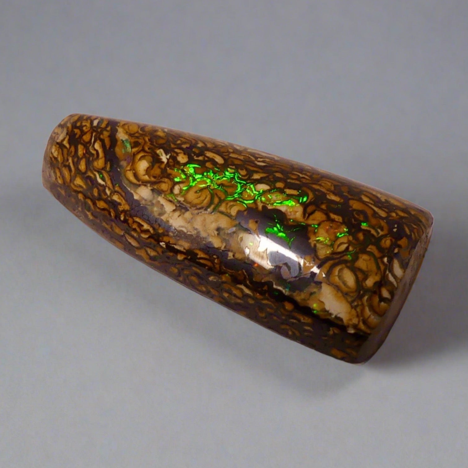 Experience the stunning 27.6ct Koroit Boulder Opal. Its vibrant greens and directional flash make it a unique and breathtaking addition to any collection.

Origin- Queensland Australia

Opal Weight- 27.4ct Koroit Boulder Opal

Size- 29 x 15mm

Beautiful Opal suitable for a Pendant setting.