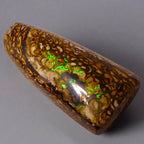 Experience the stunning 27.6ct Koroit Boulder Opal. Its vibrant greens and directional flash make it a unique and breathtaking addition to any collection.

Origin- Queensland Australia

Opal Weight- 27.4ct Koroit Boulder Opal

Size- 29 x 15mm

Beautiful Opal suitable for a Pendant setting.