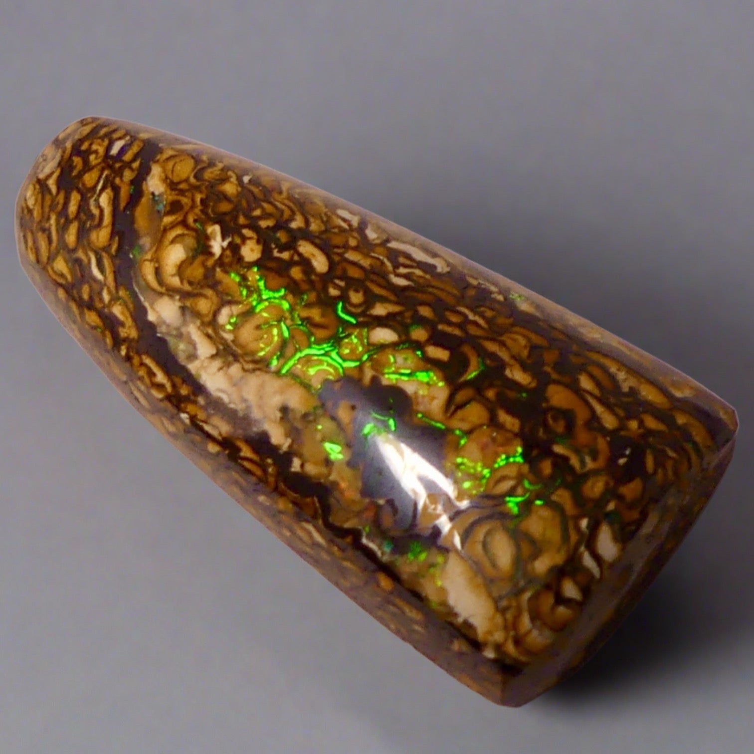 Experience the stunning 27.6ct Koroit Boulder Opal. Its vibrant greens and directional flash make it a unique and breathtaking addition to any collection.

Origin- Queensland Australia

Opal Weight- 27.4ct Koroit Boulder Opal

Size- 29 x 15mm

Beautiful Opal suitable for a Pendant setting.
