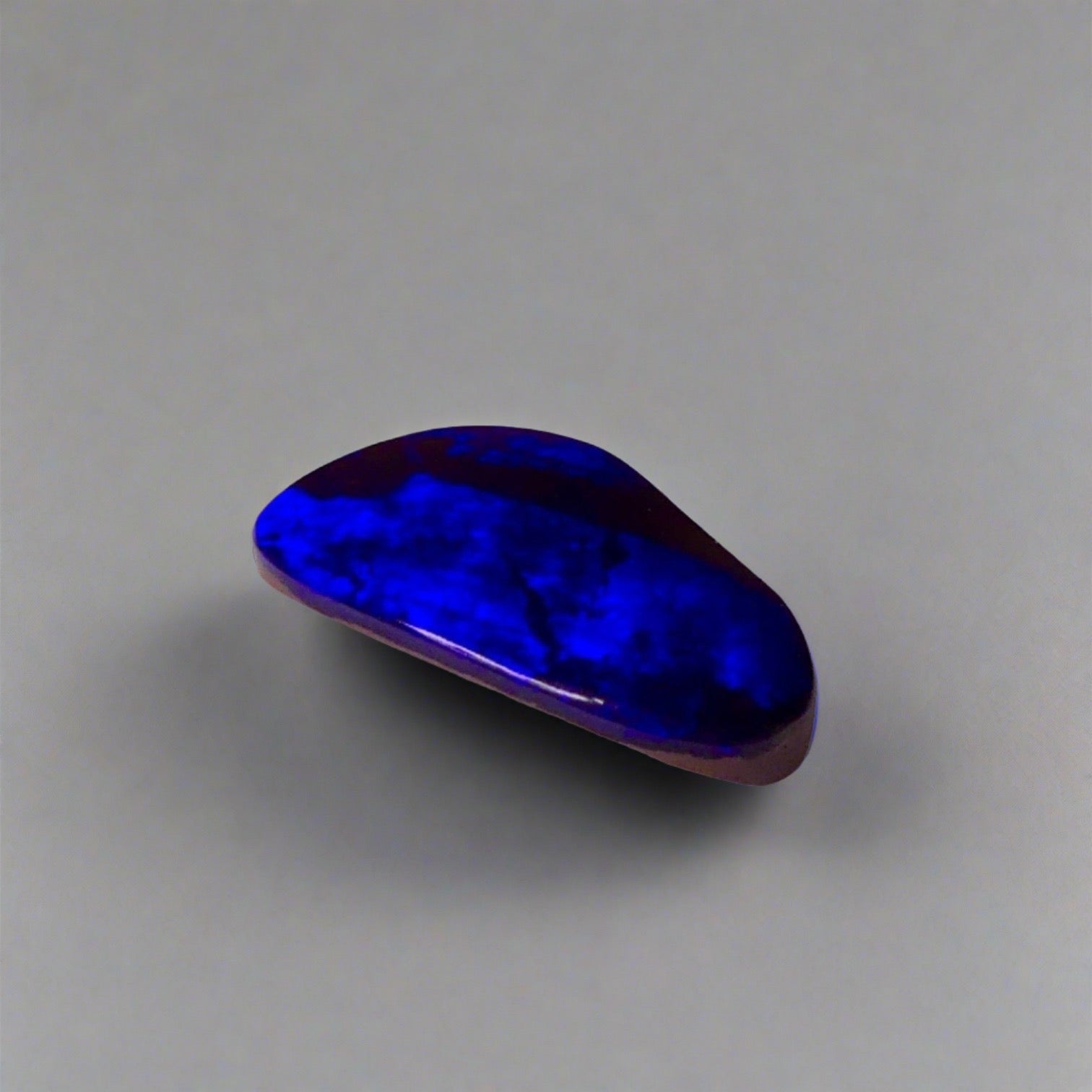 7.5ct Australian Boulder Opal showcases stunning blue flashes and deep electric blue hues, a worthy addition to any gemstone collection.

Origin- Queensland Australia

Opal Weight- 7.5ct

Size- 18.2 x 11mm

Ready to be set into your choice of jewellery