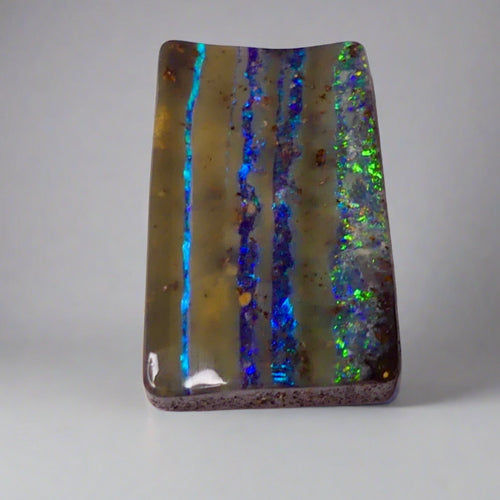 12.5ct Australian Stripy Boulder Opal: A unique gemstone, mined in Australia, that offers a one-of-a-kind look with stunning colors. Perfect for gemstone enthusiasts.

Origin- Ethically Mined in Queensland Australia

Opal Weight- 12.5ct Queensland Boulder Opal

Size- 22 x 13mm

Perfect for that next Pendant design you have been dreaming of.