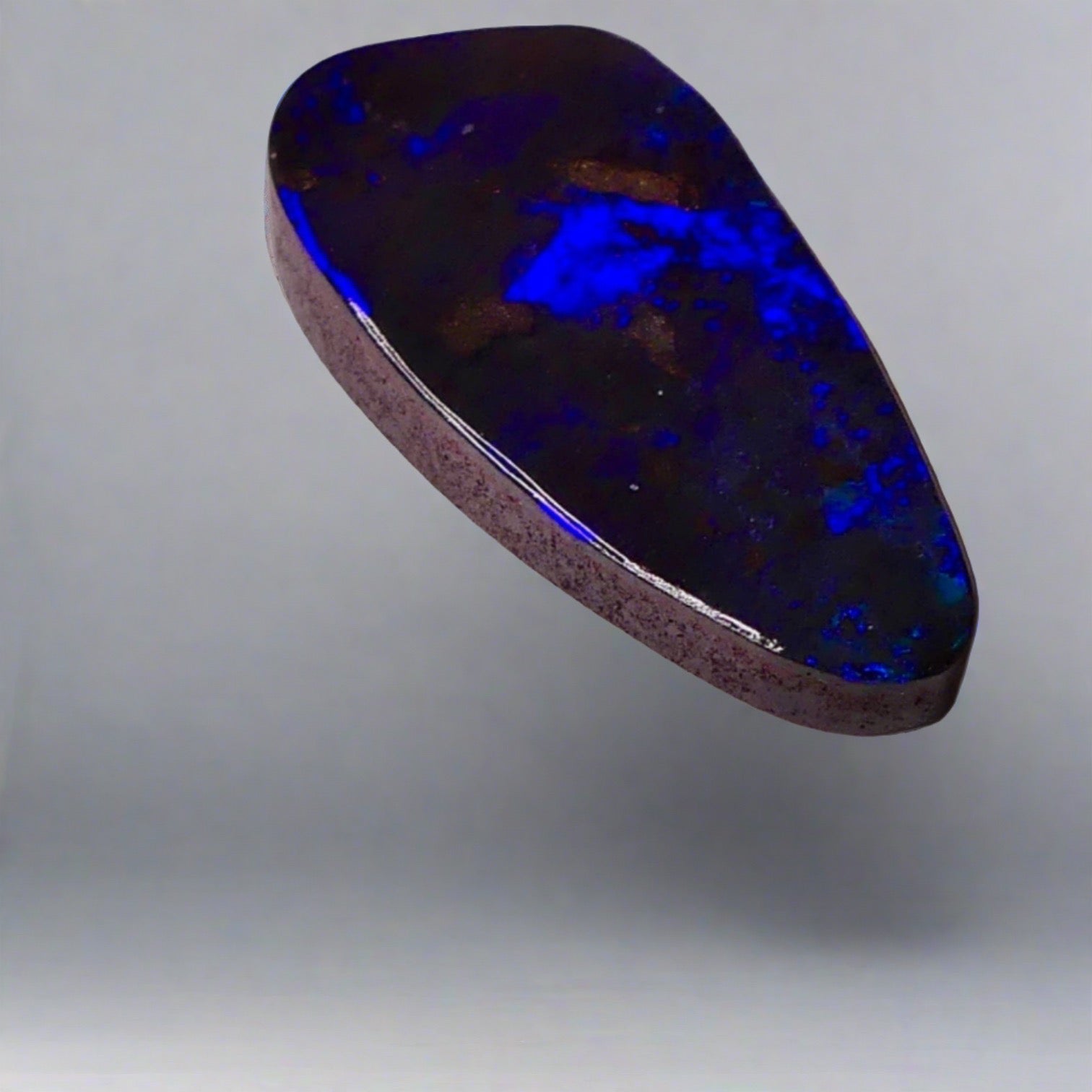 7.7ct Australian Boulder Opal showcases stunning blue hues, a worthy addition to any gemstone collection.

Origin- Ethically Mined in Queensland Australia

Opal Weight- 7.7ct

Size- 21 x 9.6mm

Ready to be set into your choice of jewellery
