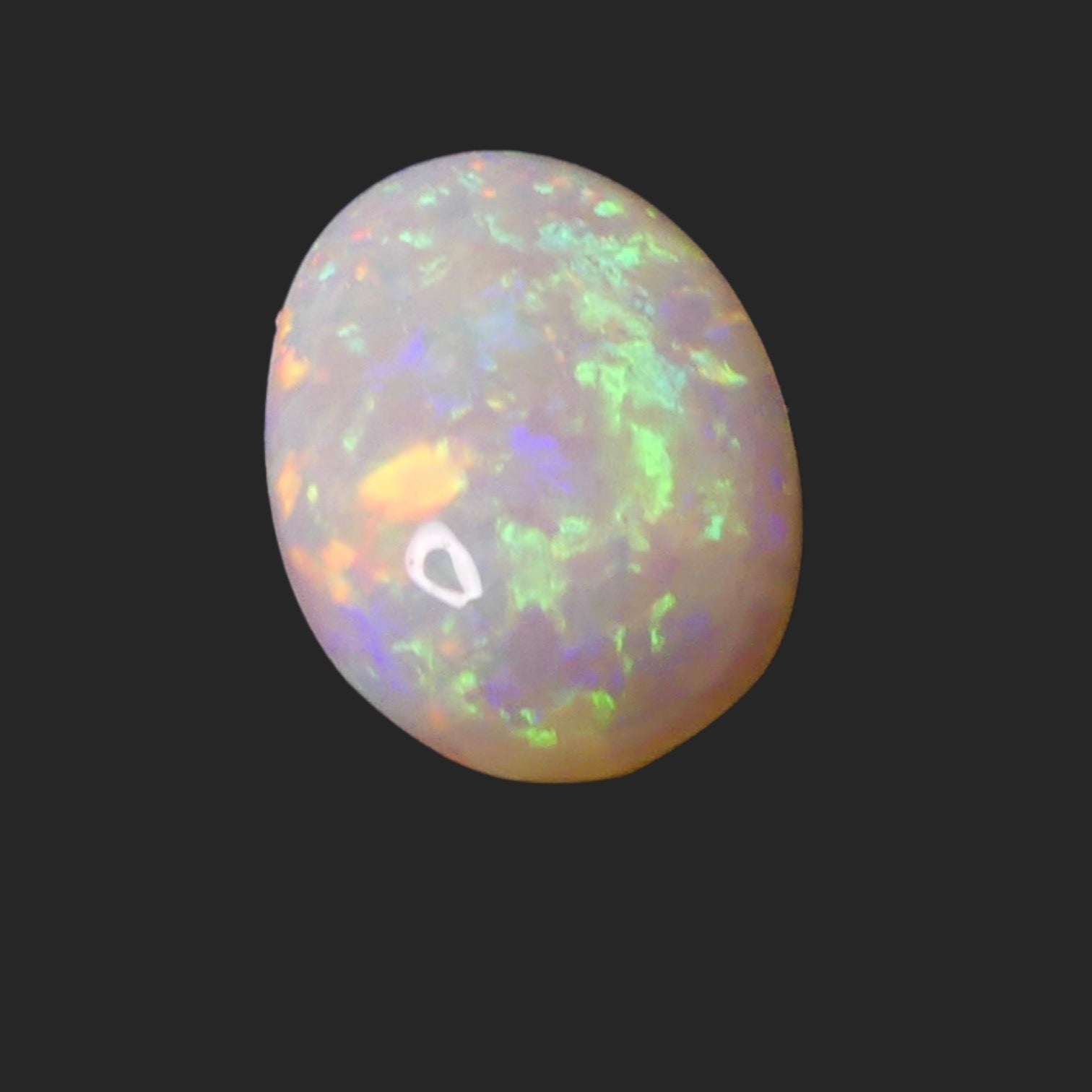 Unleash the magic of this 4ct Coober Pedy Opal! This must-have gemstone boasts captivating colors and natural beauty, perfect for making a statement in any jewelry collection. Experience the mesmerizing display of rainbow hues 

Origin-Ethically Mined in Coober Pedy Australia

Opal weight- 4ct Coober Pedy Opal

Size- 14.7 x 10.5mm

Beautiful Opal ready to set into your personally designed Jewellery setting