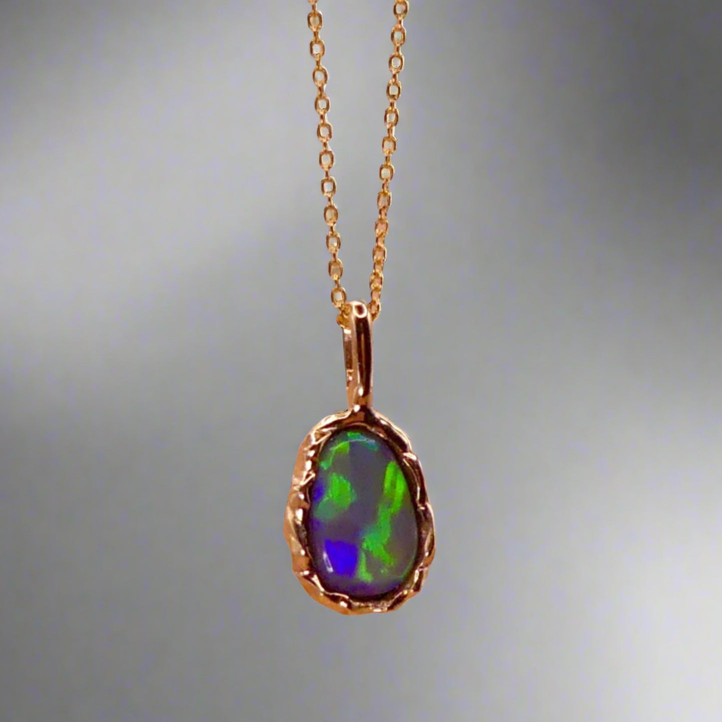 Uncover the stunning Australian opal beauty of our 9k Gold Lightning Ridge Opal pendant. Featuring a unique lava-inspired handcrafted design with green, blue, and gold tones, this high-quality masterpiece is a lasting addition to your collection.

Origin- Ethically Mined in Lightning Ridge Australia

Opal Weight- 1.5ct Lightning Ridge Crystal Opal

Setting- 9k Gold Lava inspired custom design

Chain- 9k Gold Cable Chain 45cm in Length

Treatments- None- 100% Solid Australian Opal
