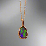 Uncover the stunning Australian opal beauty of our 9k Gold Lightning Ridge Opal pendant. Featuring a unique lava-inspired handcrafted design with green, blue, and gold tones, this high-quality masterpiece is a lasting addition to your collection.

Origin- Ethically Mined in Lightning Ridge Australia

Opal Weight- 1.5ct Lightning Ridge Crystal Opal

Setting- 9k Gold Lava inspired custom design

Chain- 9k Gold Cable Chain 45cm in Length

Treatments- None- 100% Solid Australian Opal
