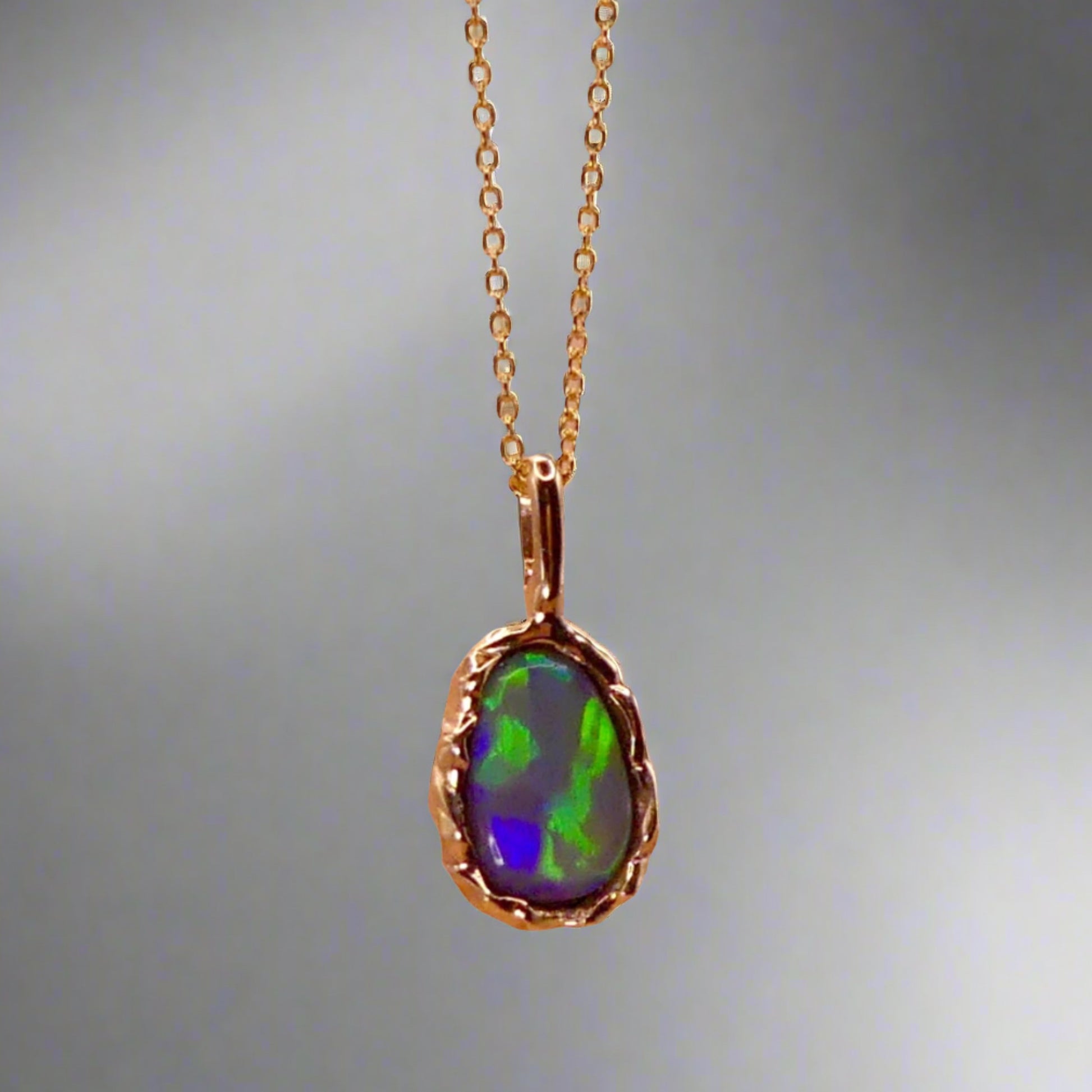 Uncover the stunning Australian opal beauty of our 9k Gold Lightning Ridge Opal pendant. Featuring a unique lava-inspired handcrafted design with green, blue, and gold tones, this high-quality masterpiece is a lasting addition to your collection.

Origin- Ethically Mined in Lightning Ridge Australia

Opal Weight- 1.5ct Lightning Ridge Crystal Opal

Setting- 9k Gold Lava inspired custom design

Chain- 9k Gold Cable Chain 45cm in Length

Treatments- None- 100% Solid Australian Opal
