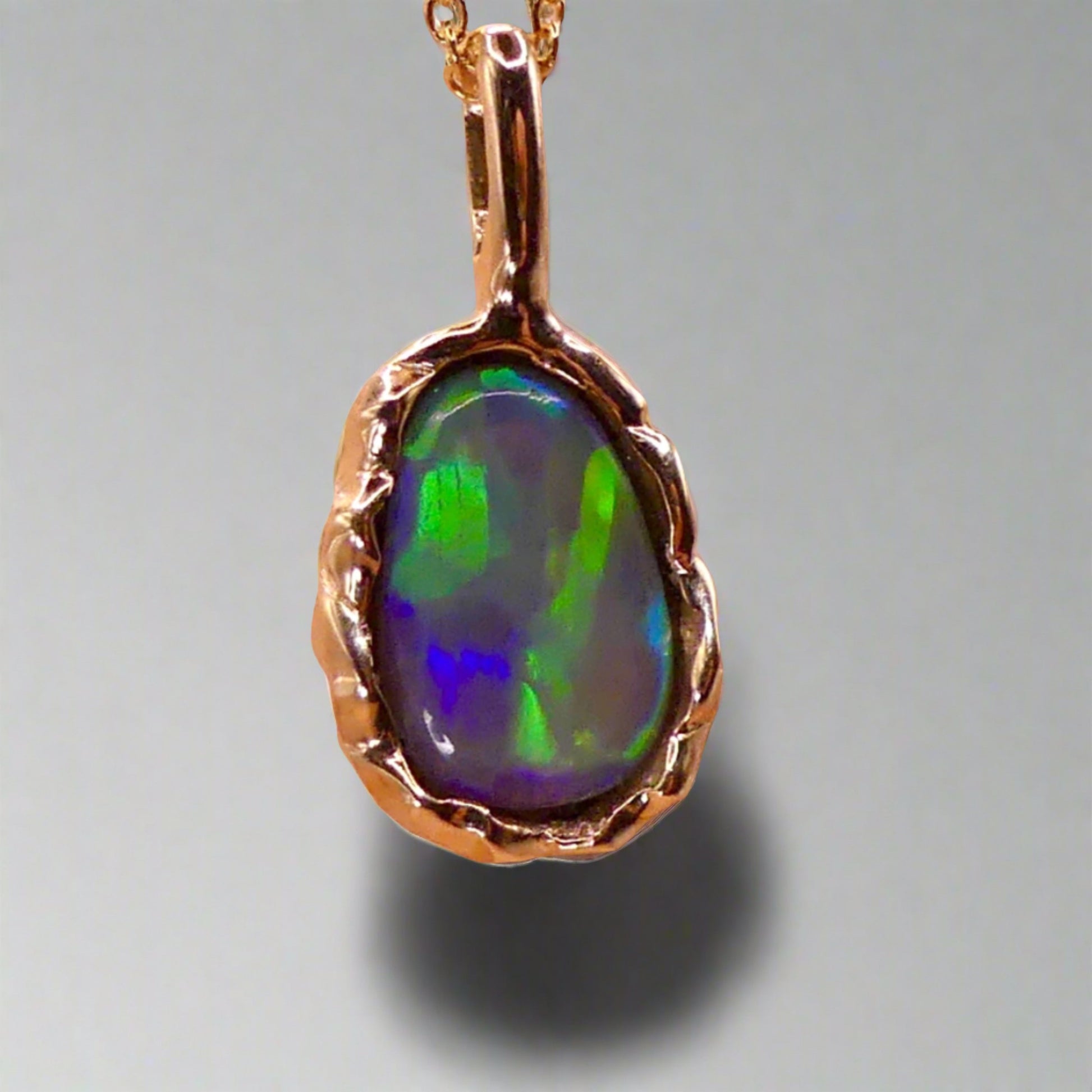 Uncover the stunning Australian opal beauty of our 9k Gold Lightning Ridge Opal pendant. Featuring a unique lava-inspired handcrafted design with green, blue, and gold tones, this high-quality masterpiece is a lasting addition to your collection.

Origin- Ethically Mined in Lightning Ridge Australia

Opal Weight- 1.5ct Lightning Ridge Crystal Opal

Setting- 9k Gold Lava inspired custom design

Chain- 9k Gold Cable Chain 45cm in Length

Treatments- None- 100% Solid Australian Opal
