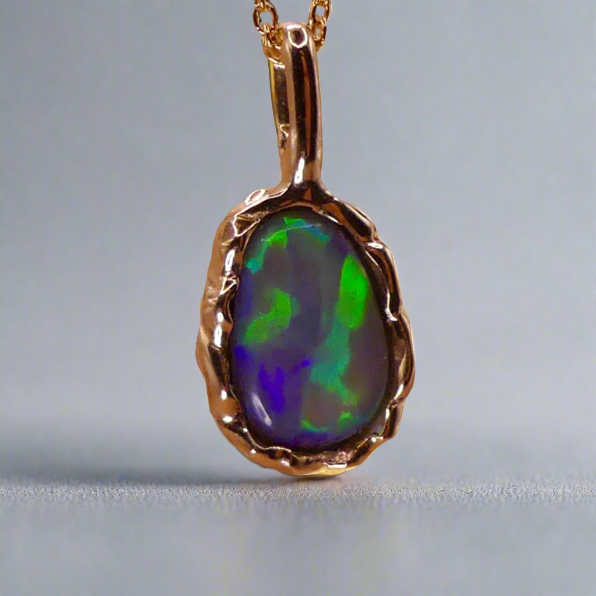 Uncover the stunning Australian opal beauty of our 9k Gold Lightning Ridge Opal pendant. Featuring a unique lava-inspired handcrafted design with green, blue, and gold tones, this high-quality masterpiece is a lasting addition to your collection.

Origin- Ethically Mined in Lightning Ridge Australia

Opal Weight- 1.5ct Lightning Ridge Crystal Opal

Setting- 9k Gold Lava inspired custom design

Chain- 9k Gold Cable Chain 45cm in Length

Treatments- None- 100% Solid Australian Opal
