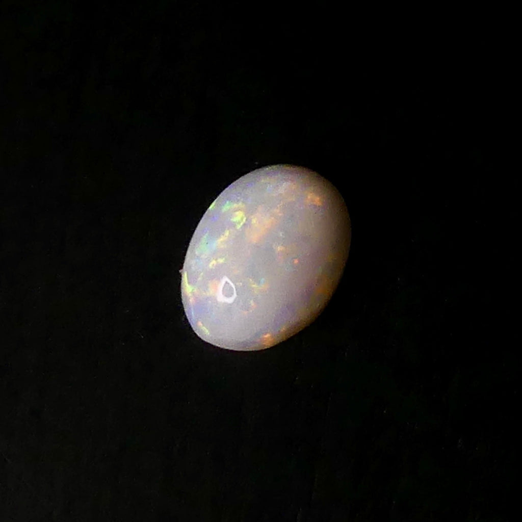 Explore the exquisite natural patterns and colors of our 0.9ct Coober Pedy Opal ring stone. A captivating treasure from the Coober Pedy region.

Origin- Ethically Mined in Coober Pedy Australia

Opal Weight- 0.9ct- Coober Pedy Opal

Size- 8.4 x 6.3 x 2.8mm

Cut- Freeform high dome cabochon

Treatments- None 100% solid Australian Opal