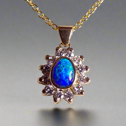 Experience the captivating allure of this handcrafted 18K Yellow Gold Opal &amp; Diamond Halo Pendant. With a striking Lightning Ridge opal showcasing a rare and sought-after script pattern consisting of blue, green, and gold tones, complemented by radiant diamonds, this necklace is a sophisticated and essential piece for any collection.

Origin- Lightning Ridge Australia

Opal Weight- 1ct Australian Lightning Ridge Semi Black Opal

Setting- 18k Yellow Gold Bezel set, claw set Diamond Halo