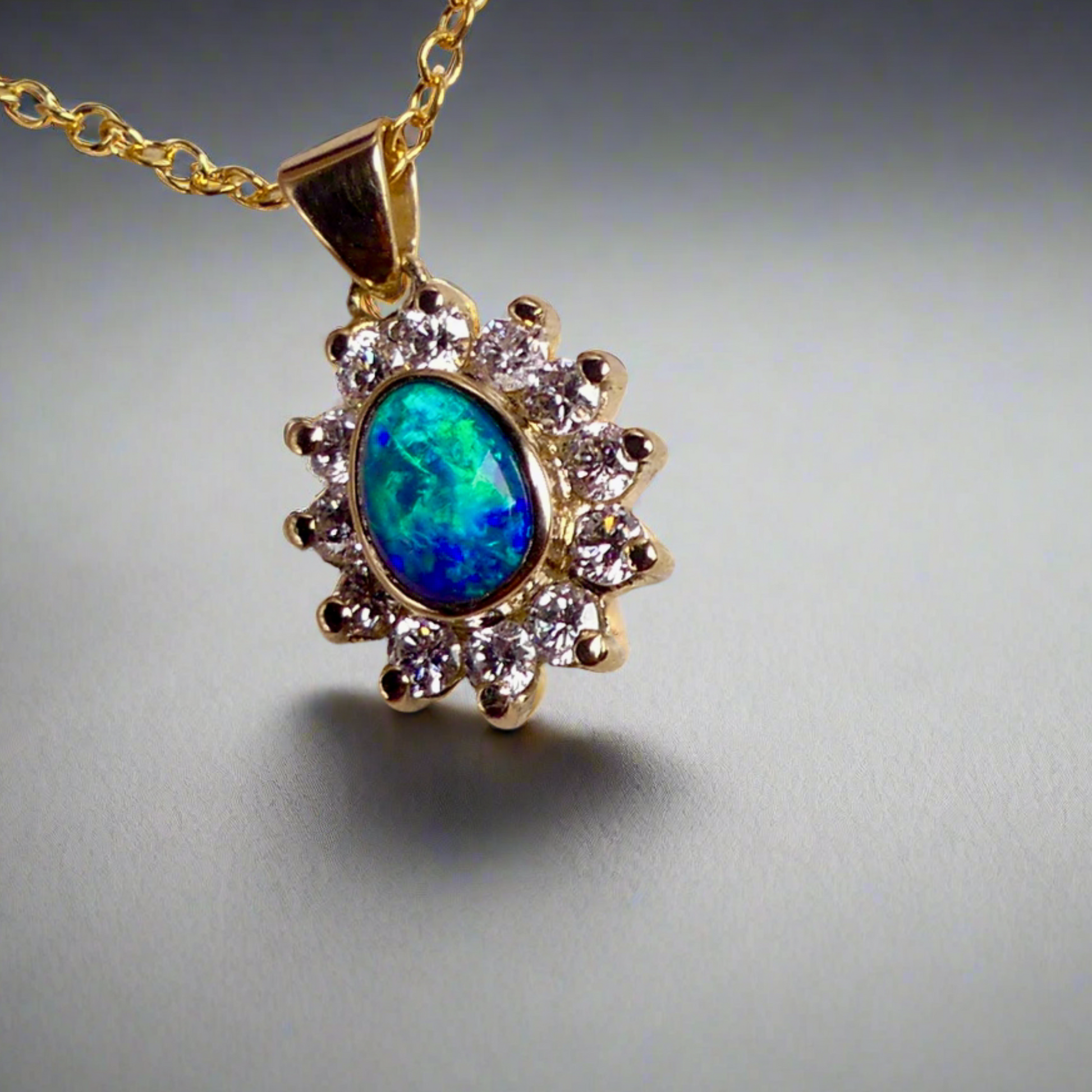 Experience the captivating allure of this handcrafted 18K Yellow Gold Opal &amp; Diamond Halo Pendant. With a striking Lightning Ridge opal showcasing a rare and sought-after script pattern consisting of blue, green, and gold tones, complemented by radiant diamonds, this necklace is a sophisticated and essential piece for any collection.

Origin- Lightning Ridge Australia

Opal Weight- 1ct Australian Lightning Ridge Semi Black Opal

Setting- 18k Yellow Gold Bezel set, claw set Diamond Halo