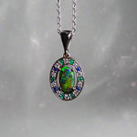 Lightning Ridge Australian black opal with strong, highly prized colors of reds, orange, and yellows is undoubtedly a remarkable gemstone. Expertly crafted from 18k white gold, this pendant showcases the mesmerizing beauty of an Australian black opal, surrounded by sparkling diamonds, emeralds, and sapphires. Exquisite in design and quality, this pendant is a luxurious addition to any jewelry collection. Elevate your style with this stunning piece.

Opal Weight- 1.1ct

Body Tone- N1 Australian Black