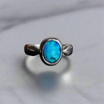 This Vibrant Sterling Silver Boulder Opal Ring showcases stunning ocean blue hues, making it a truly eye-catching accessory. Crafted with high-quality sterling silver and featuring a boulder opal, this ring is both beautiful and durable. Elevate any outfit with this striking piece of jewelry.

Origin- Ethically mined in Queensland Australia

Opal Weight- 1.9ct

Setting- Sterling Silver

Size- 6 1/2us

Crafted By Passionate Australian Artisans