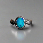 This Vibrant Sterling Silver Boulder Opal Ring showcases stunning ocean blue hues, making it a truly eye-catching accessory. Crafted with high-quality sterling silver and featuring a boulder opal, this ring is both beautiful and durable. Elevate any outfit with this striking piece of jewelry.

Origin- Ethically mined in Queensland Australia

Opal Weight- 1.9ct

Setting- Sterling Silver

Size- 6 1/2us

Crafted By Passionate Australian Artisans