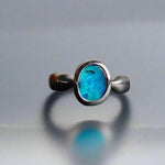 This Vibrant Sterling Silver Boulder Opal Ring showcases stunning ocean blue hues, making it a truly eye-catching accessory. Crafted with high-quality sterling silver and featuring a boulder opal, this ring is both beautiful and durable. Elevate any outfit with this striking piece of jewelry.

Origin- Ethically mined in Queensland Australia

Opal Weight- 1.9ct

Setting- Sterling Silver

Size- 6 1/2us

Crafted By Passionate Australian Artisans