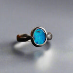 This Vibrant Sterling Silver Boulder Opal Ring showcases stunning ocean blue hues, making it a truly eye-catching accessory. Crafted with high-quality sterling silver and featuring a boulder opal, this ring is both beautiful and durable. Elevate any outfit with this striking piece of jewelry.

Origin- Ethically mined in Queensland Australia

Opal Weight- 1.9ct

Setting- Sterling Silver

Size- 6 1/2us

Crafted By Passionate Australian Artisans